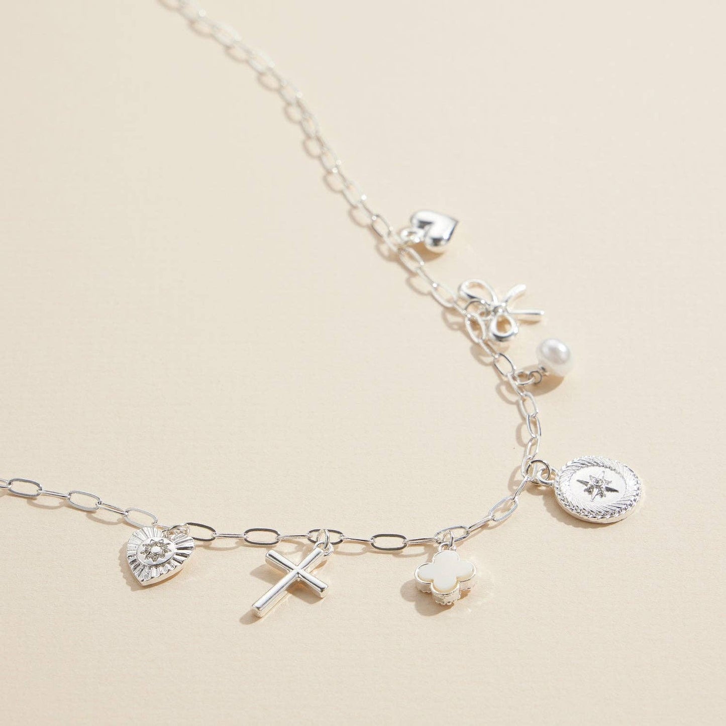 Charm Necklace with Heart, Cross, Compass Pearl, and Bow Pendants